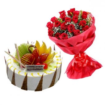 fruit cake with 10 red roses