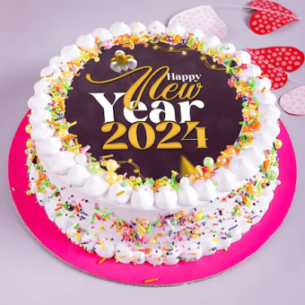 A colorful New Year 2024 celebration cake with white frosting and sprinkles on a pink base.