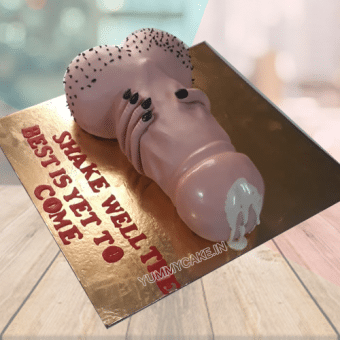 penis shaped cake with message "Shake well the best is yet to come"