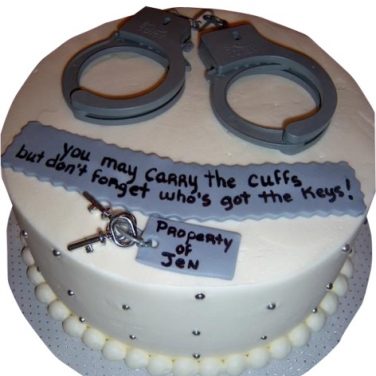 A cake with handcuffs on it