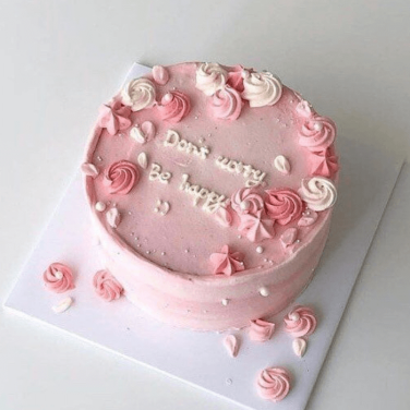 beautiful pink cake with cream flowers