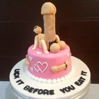 a pink color cake with penis on the top