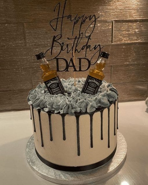 jack daniels whiskey bottle with dripe cake