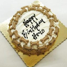 round dog cake with bone designs