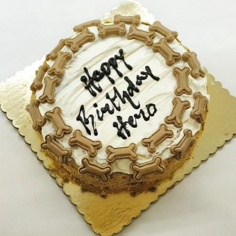 round dog cake with bone designs