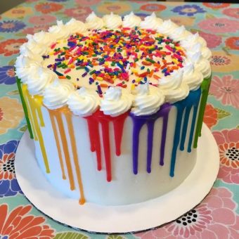 rainbow drip cake with sprinkles