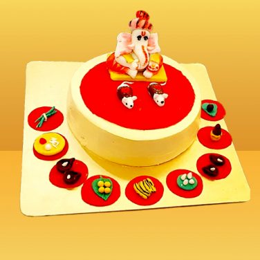 a cake with ganesh on top