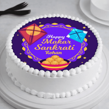 A cake with 'Happy Makar Sankranti Rohan' text and festive designs