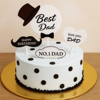 White cake with black dots and “No.1 Dad” toppers