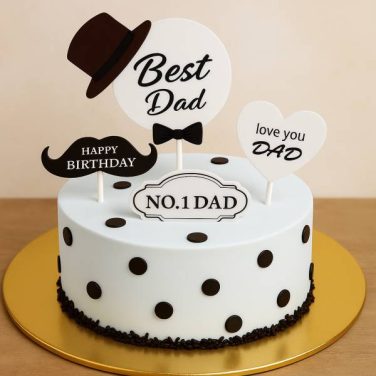 White cake with black dots and “No.1 Dad” toppers