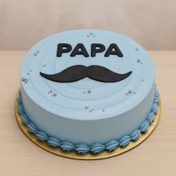 Blue cake with “Papa” and moustache design