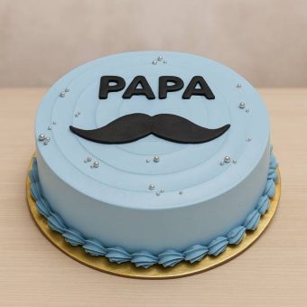 Blue cake with “Papa” and moustache design