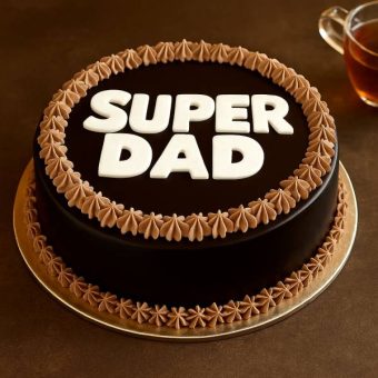 Chocolate cake with “Super Dad” on top