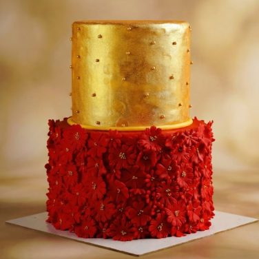 2 tier red and gold floral wedding cake