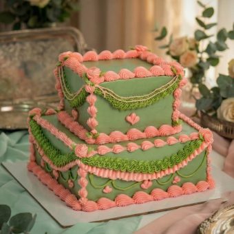 green and pink square vintage wedding cake