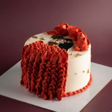 love theme cake with red ruffles