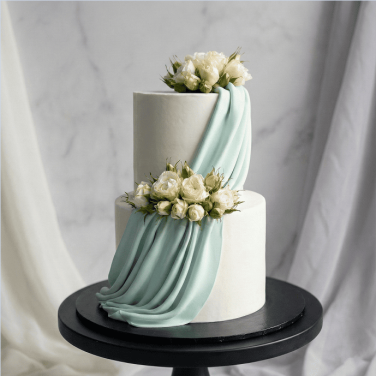 two tier drape floral wedding cake