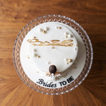 bridal shower cake with bride figurine top view