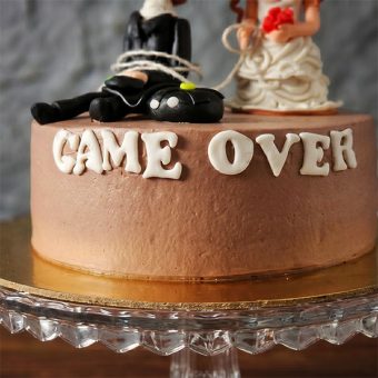 game over cake with couple topper front view
