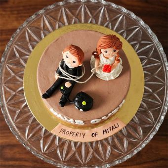 game over cake with couple topper top view