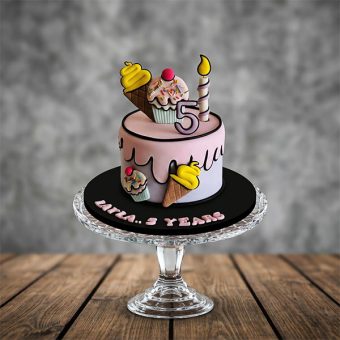 2D cartoon style pink drip cake with ice cream and cupcake toppers.